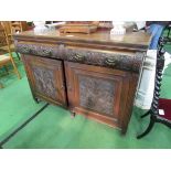 Oak sideboard with carved drawers and cupboard doors, 137 x 53 x 98cms. Estimate £20-40.