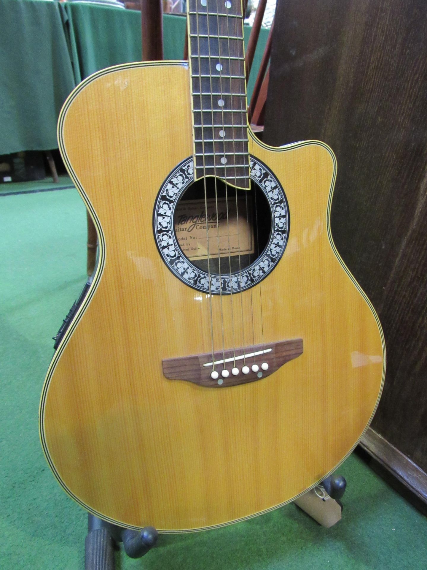 Tanglewood electro-acoustic guitar. Estimate £30-50.
