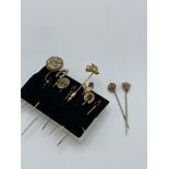 2 x 9ct gold stick pins and 9 others. Estimate £20-30.
