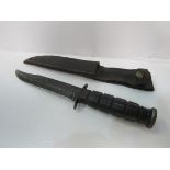 US Marine Corps KA-BAR knife complete with leather scabbard. Estimate £20-40.
