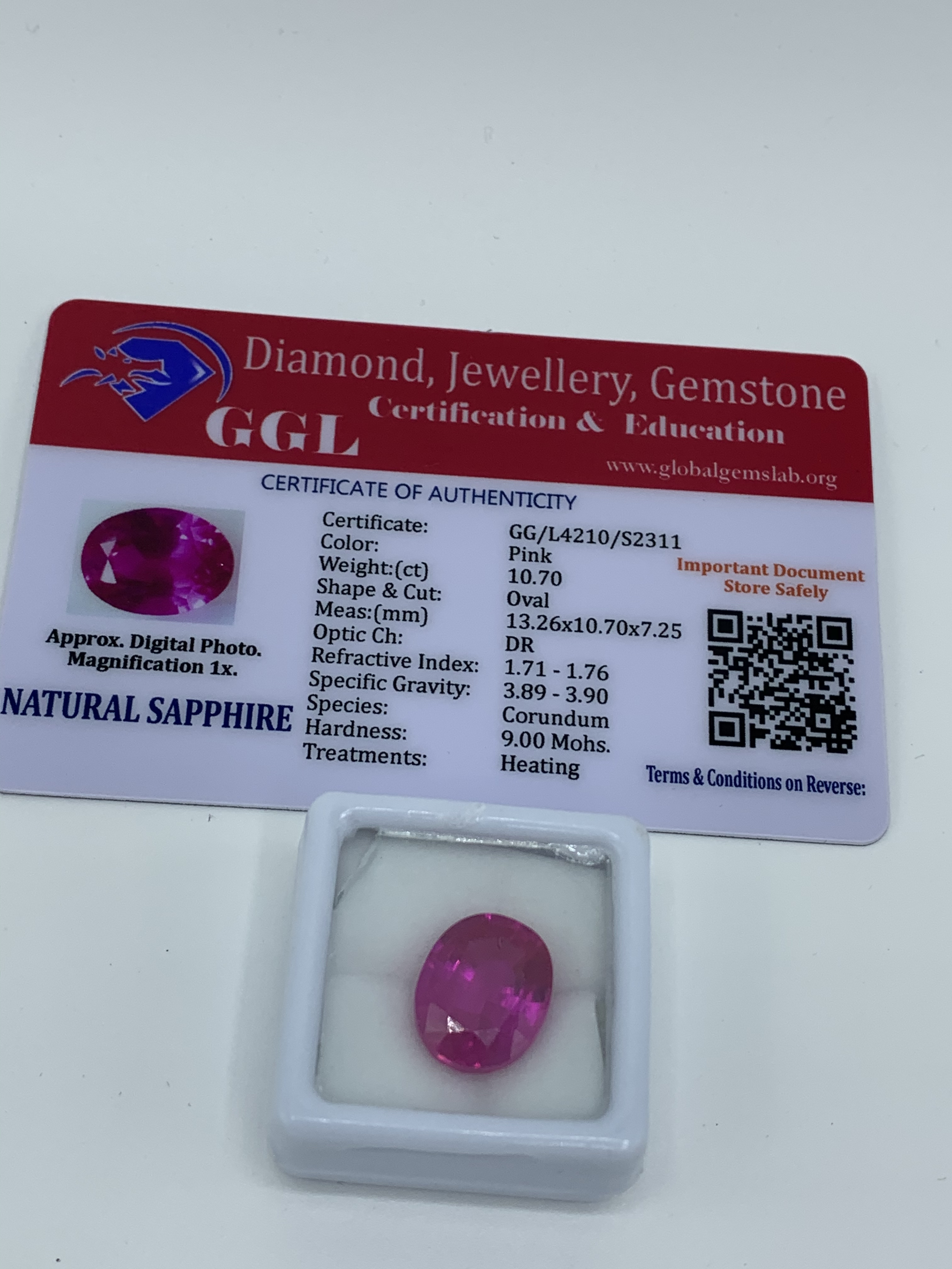 Oval cut pink sapphire, weight 10.70ct with certificate. Estimate £40-50.