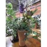 Terracotta flower pot together with display of artificial flowers. Height 40cms. Estimate £20-40.
