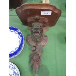 Carved wooden wall bracket. Estimate £20-30.