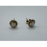 9ct gold and opal stud earrings, weight 1.0gm. Estimate £30-50.
