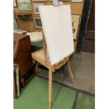New artist's easel together with pastels and brushes. Estimate £35-50.