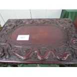 Carved wood campaign table with lifting lid and folding legs, inscribed on underside of lid. From