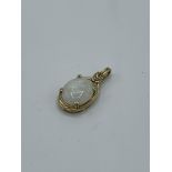9ct gold set large natural opal and diamond pendant, weight 2.9gms. Estimate £600-650.