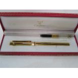 Must De Cartier gold coloured fountain pen, marked Aspinalls, in original red leatherette case