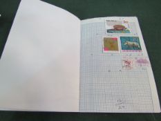 Box of stamps, 45 world club books. Estimate £30-35.