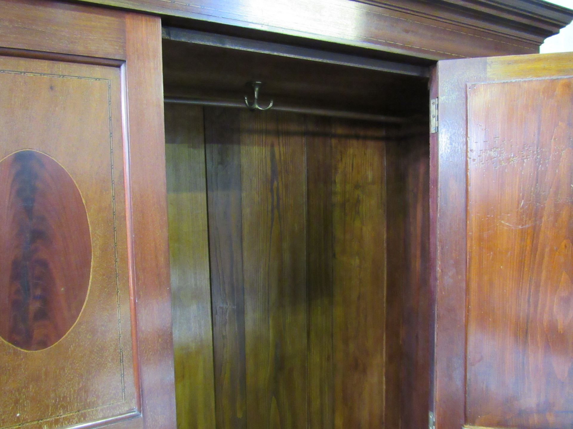 Edwardian mahogany wardrobe with oval door mirror & drawer to base, 116 x 45 x 204cms. Estimate £ - Image 4 of 5