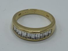 18ct gold ring set with 10 baguette diamonds, size N, weight 4.3gms. Estimate £400-500.