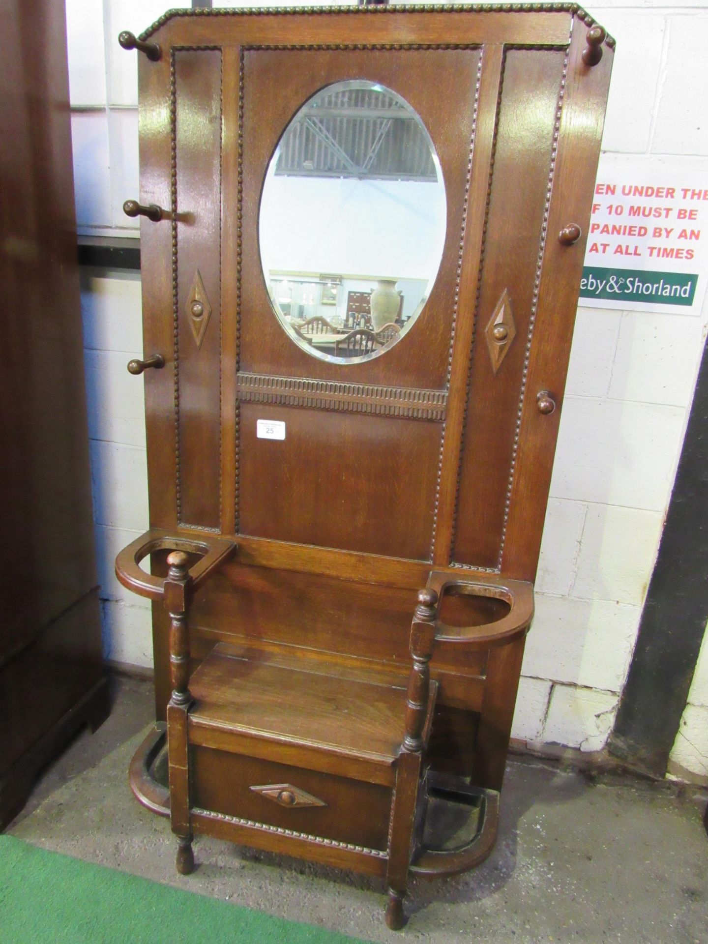 Oak mirror backed hall stand with integral box storage seat. Estimate £20-40.