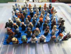 A quantity of Lego, including Star Wars, mini figures, Millennium Falcon etc plus instructions and