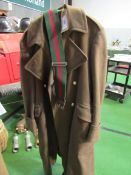 Military overcoat together with a belt. Estimate £30-50.