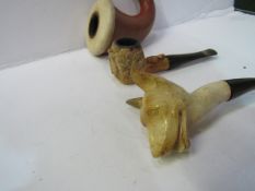 2 x Peterson Meershaum pipes, boxed and another pipe . Estimate £20-30.