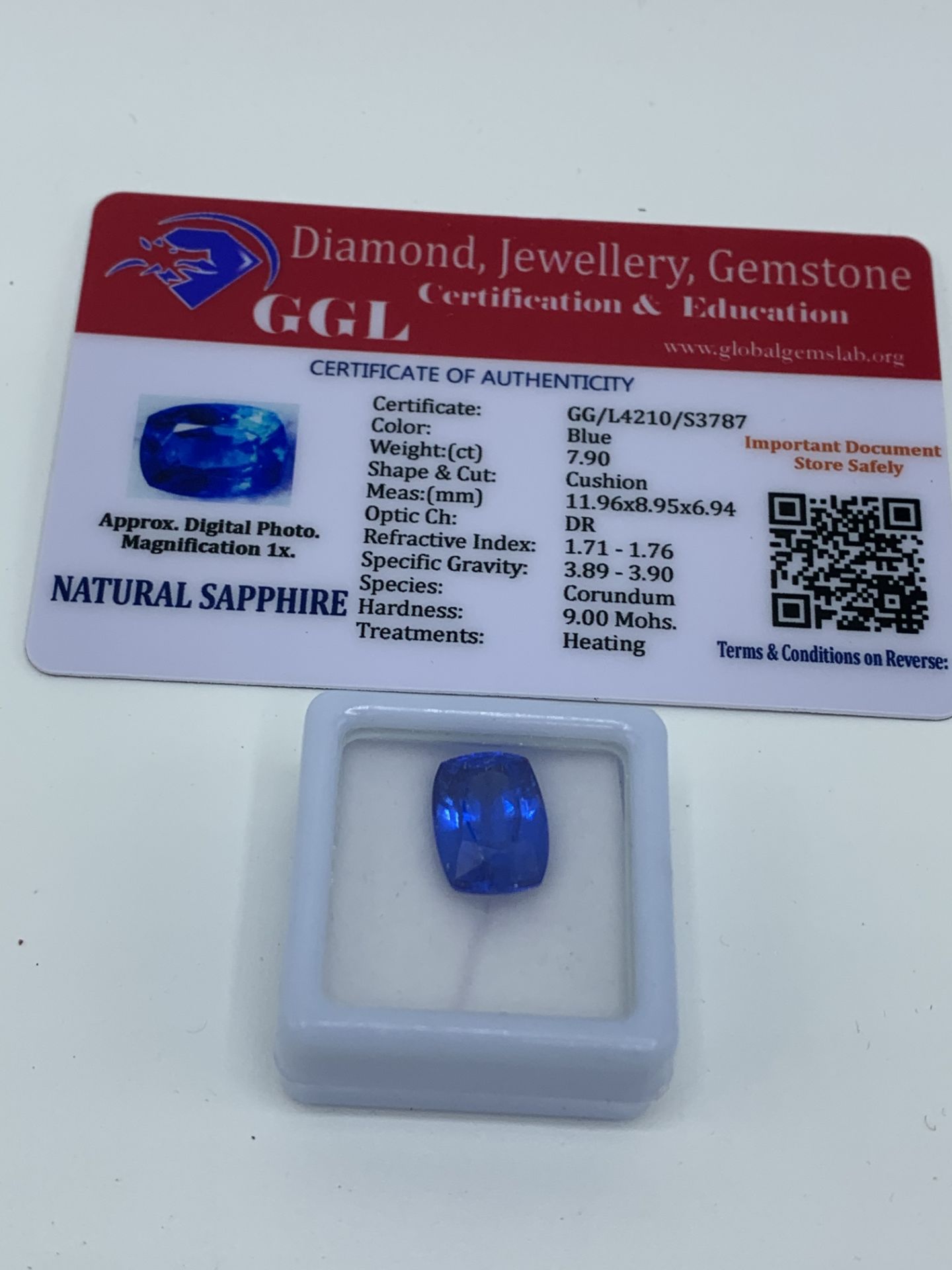 Cushion cut blue sapphire, weight 7.90ct with certificate. Estimate £40-50.