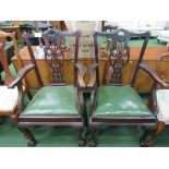 2 mahogany framed Chippendale-style open armchairs. Estimate £20-40.