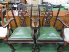 2 mahogany framed Chippendale-style open armchairs. Estimate £20-40.