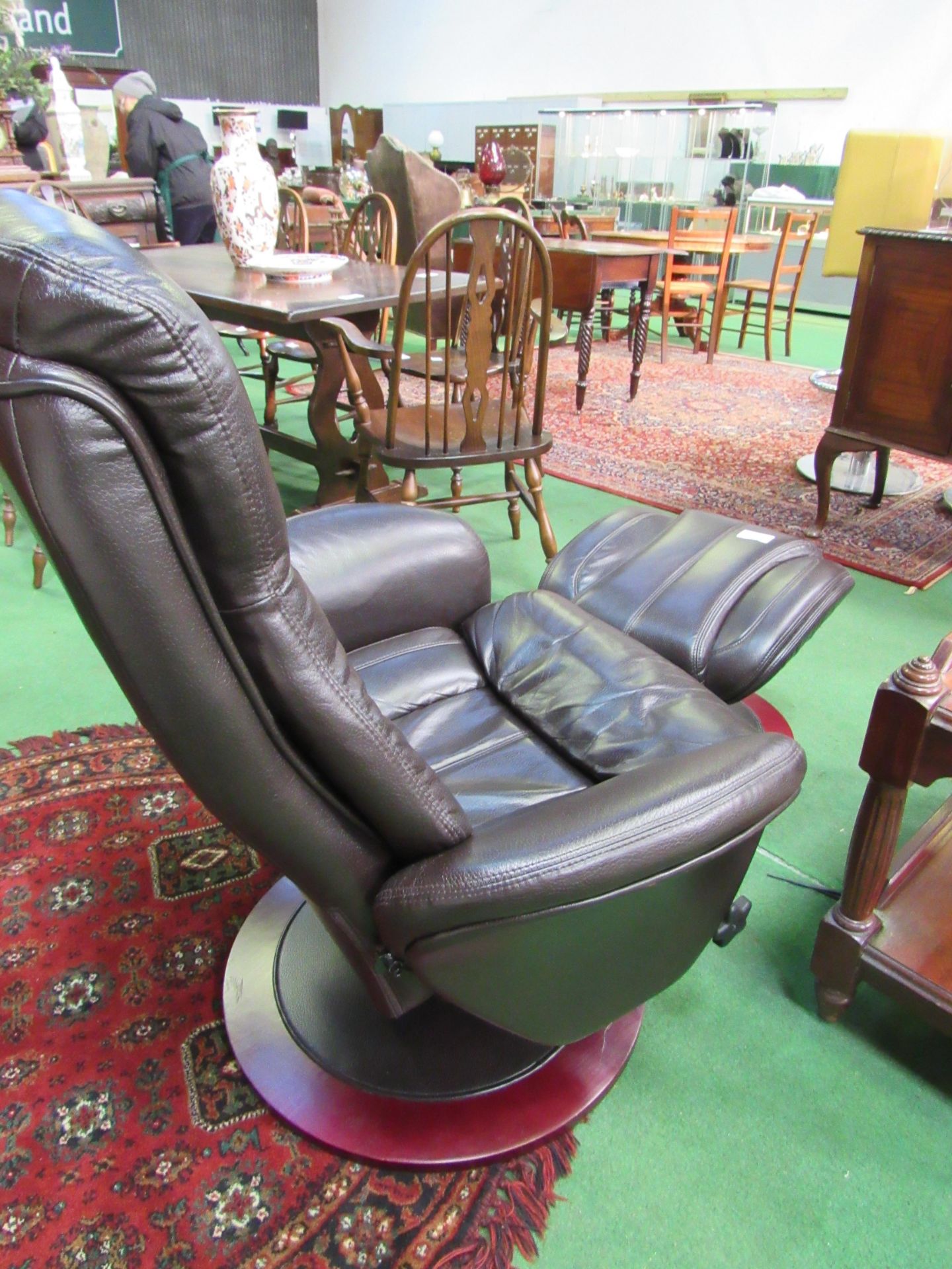 Dark brown leather-effect swivel chair and footstool. Estimate £30-50. - Image 4 of 4