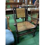 Oak armchair with cane back and seat. Estimate £20-30.