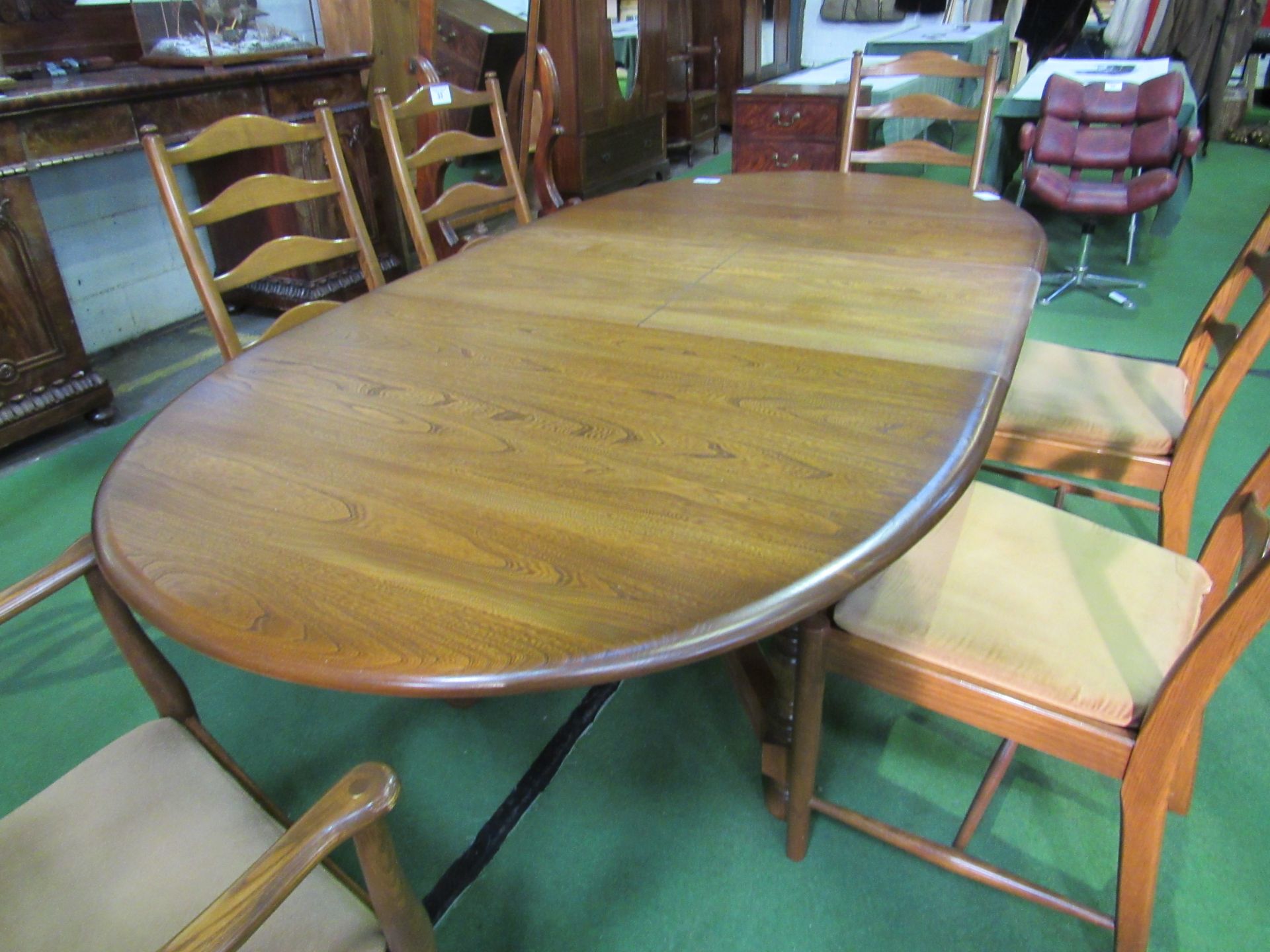 Ercol extending dining table, 212 x 108cms. Estimate £100-150.