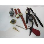 8 various wrist watches and tie clip and a silver cased propelling pencil. Estimate £20-40.