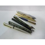 Quantity of pens and propelling pencils. Estimate £15-20.