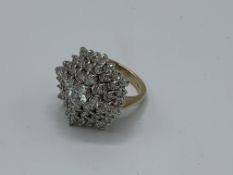 9ct gold ring set with large cluster of white stones, size T, weight 11.1gms. Estimate £300-320.
