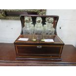 Rosewood Tantalus of 3 cut glass decanters with front compartment and secret drawer. Estimate £30-