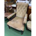 Victorian/Edwardian brown upholstered armchair on casters. Estimate £20-40.