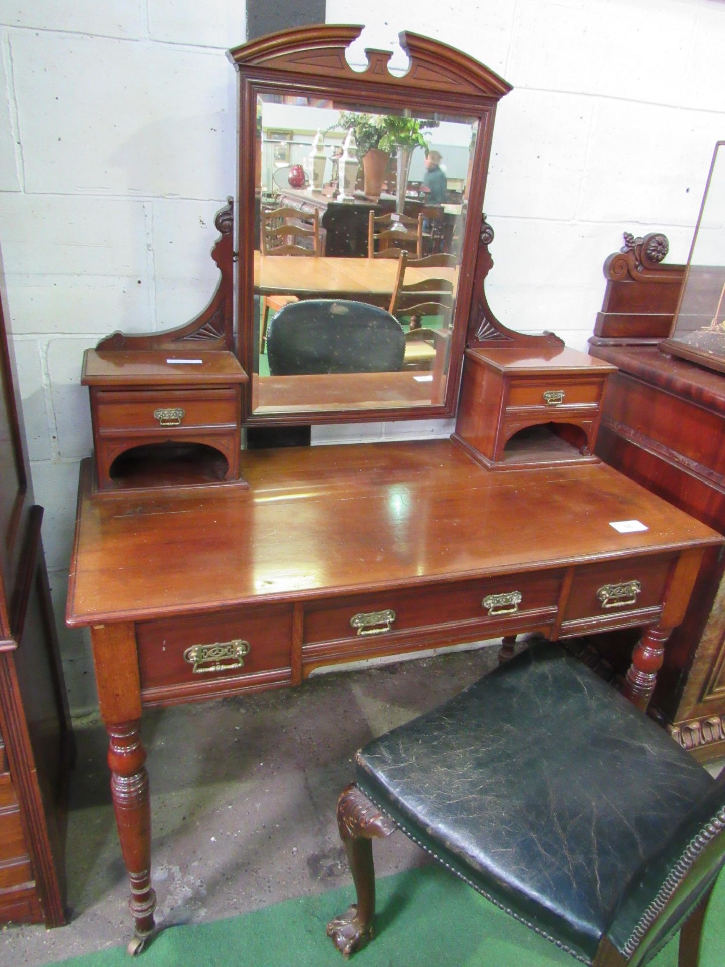 Mahogany dressing table with three frieze drawers, mirror flanked by two small cabinets, turned legs