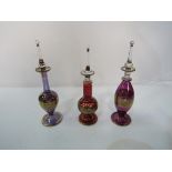 Set of 3 Italian gilt glass dropper perfume bottles. Estimate £15-20.