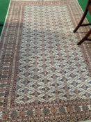 Light brown ground patterned rug, 247 x 157. Estimated 20-40