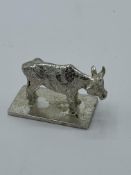 Bier of Israel silver cow. Estimate £25-35.