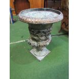 Copper garden urn, height 60cms; lead cherub supporting a fountain, height 75cms; metal winged