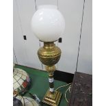 Brass table lamp complete with glass shade. Height 74cms. Estimate £20-30.