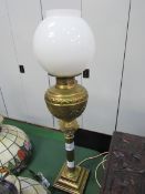 Brass table lamp complete with glass shade. Height 74cms. Estimate £20-30.