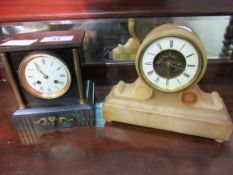 Slate mantel clock and art deco mantel clock with visible escapement. Estimate £40-60.