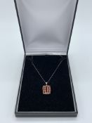 9ct white gold necklace with orange sapphire pendant, length 24cms. wt 4.6gms Estimate £20-40