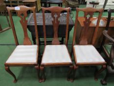 3 oak high back chairs with drop-in seats. Estimate £15-25.