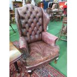 Hand dyed antique leather Regency-style button back wing armchair. Estimate £100-120.