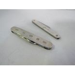 2 silver cased pen knives. Estimate £25-30.