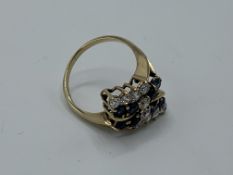 9ct gold ring set with blue and white stones, size P, weight 3.6gms. Estimate £150-180.