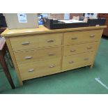Laminated oak long chest of 6 drawers. 142 x 43 x 84cms. Estimate £80-100.