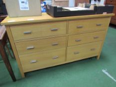 Laminated oak long chest of 6 drawers. 142 x 43 x 84cms. Estimate £80-100.