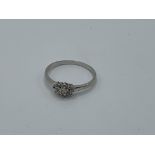 9ct white gold petite cluster ring, size R, weight 1.7gms. Estimate £50-70.