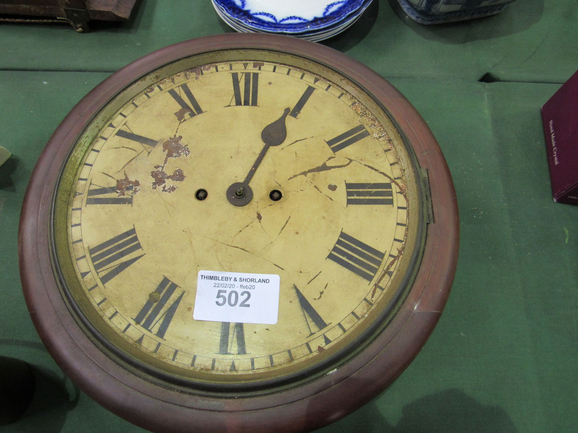 Inlaid mahogany case mantel clock and a wall dial clock in need of restoration. Estimate £20-40.