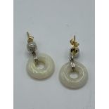 Circular opal and diamond earrings, weight 1.7gms. Estimate £250-280.