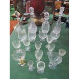 3 cut glass decanters and another and a quantity of drinking glasses. Estimate £20-30.