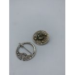 Sterling silver circular Celtic-style brooch and a Scottish silver circular sash brooch. Estimate £